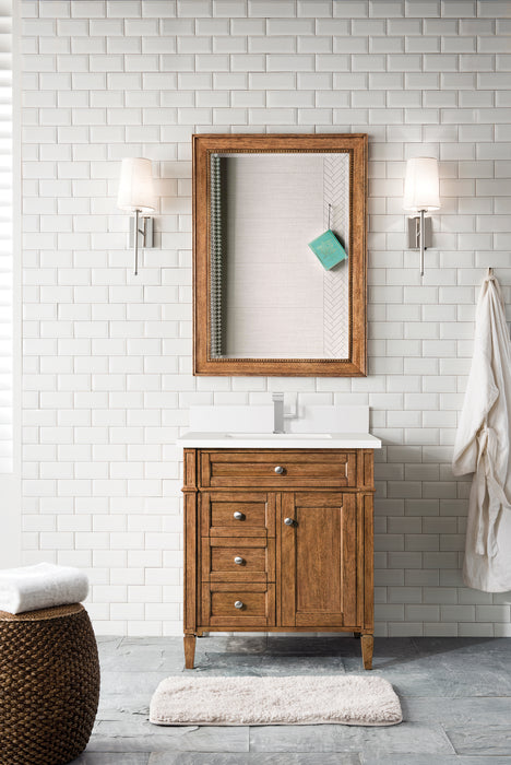 James Martin Brittany 30" Single Bathroom Vanity in Saddle Brown, shown in a bathroom setting