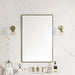 James Martin Rohe 26" Rectangular Mirror in Champagne Brass, shown in a bathroom setting