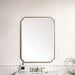 James Martin Rohe 30" Octagonal Mirror in Champagne Brass, shown in a bathroom setting
