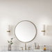James Martin Rohe 30" Round Mirror in Champagne Brass, shown in a bathroom setting